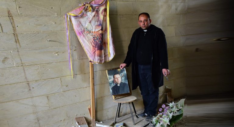 Fr Thabet Habeb Mansur wept to see what extremists did to Fr Ragheed Ganni’s grave.