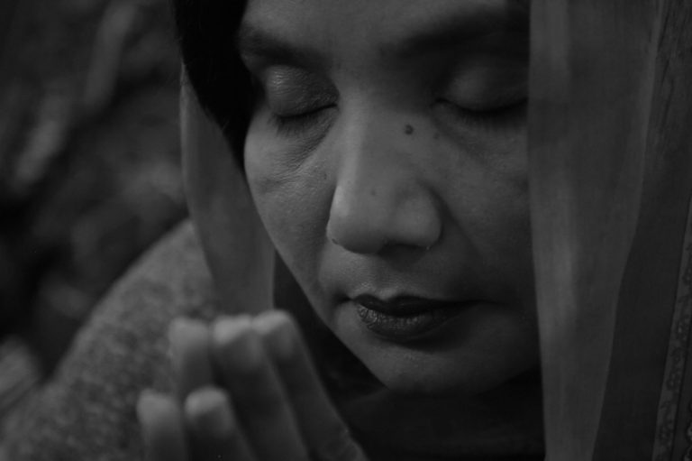 A woman praying in a Catholic Church in Youhanabad, Pakistan.