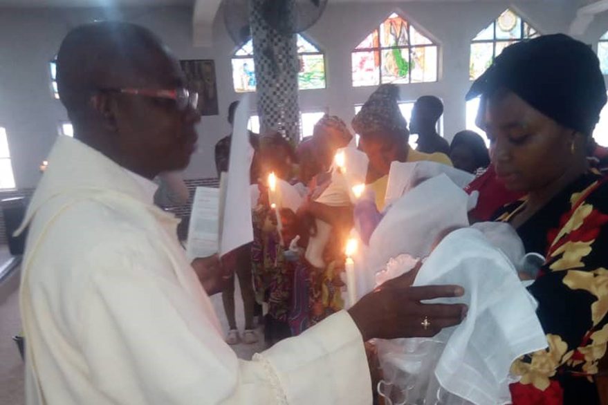 With picture of killed priest Father Joseph Bako (© Father Emmanuel Anyanwu)