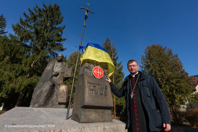 Bishop Edward Kawa at the statue of Pope Saint John Paul II in Lviv.