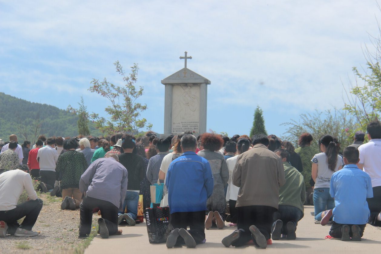 Catholics praying in China.