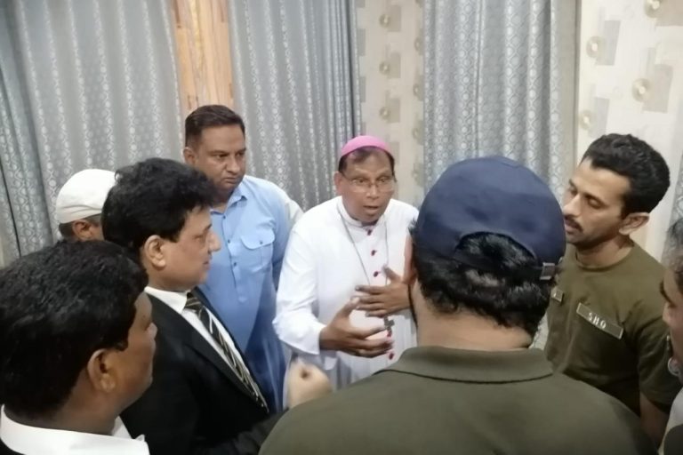 Archbishop Joseph Arshad and Senator Tahir Khalil Sindu visiting the Sargodha police headquarters after the attack.
