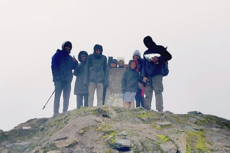 The Do Rozario and Pampackal families on top of Ben Nevis. (© Aloma Pampackal)