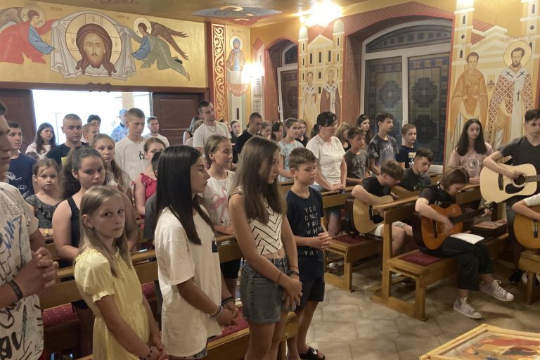 Summer camp youngsters take part in a church service in Mukachevo diocese, Ukraine.